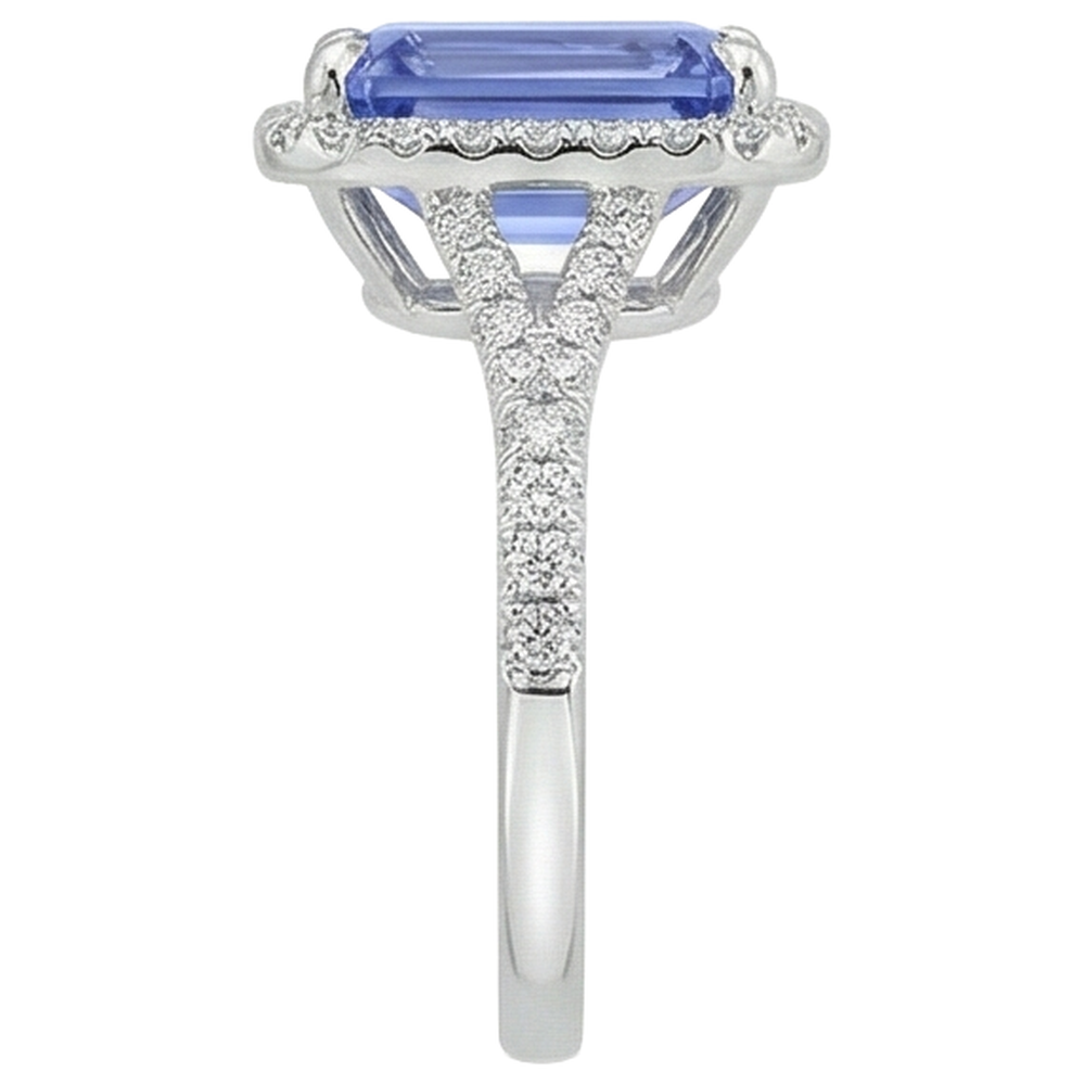 Anello in oro con tanzanite a forma di smeraldo da 8.75 ct con diamanti rotondi