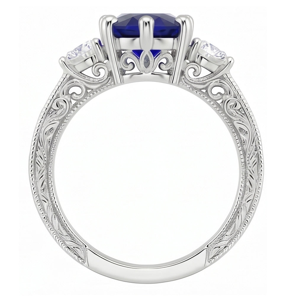 Anello old style con zaffiro blu 2,50 carati e diamanti 3 pietre in oro bianco 14K