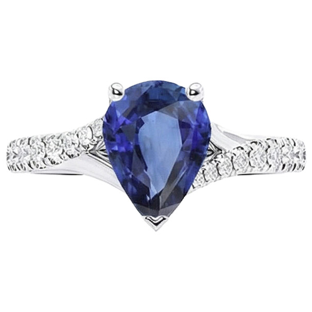 Anello solitario zaffiro blu oro bianco pavé di diamanti 4 carati