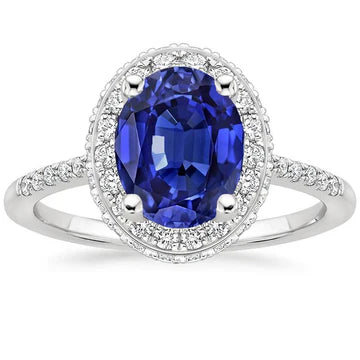 Anello Halo con zaffiro blu taglio ovale 3,75 carati e pavé di diamanti in oro bianco 14K