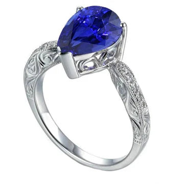Anello con pietre preziose in filigrana con stelo in zaffiro di Ceylon a 2 carati e diamanti in oro bianco 14K