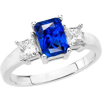 Anello con zaffiri blu Radiant 3 carati e diamanti Princess in oro bianco 14K
