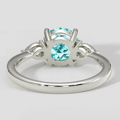 Anello rotondo con tormalina Paraiba e tre pietre