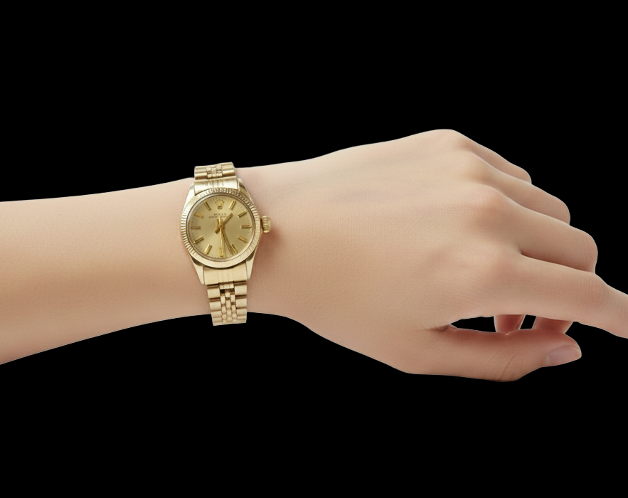 Orologio Rolex Oyster Perpetual da 24 mm con quadrante champagne e oro giallo