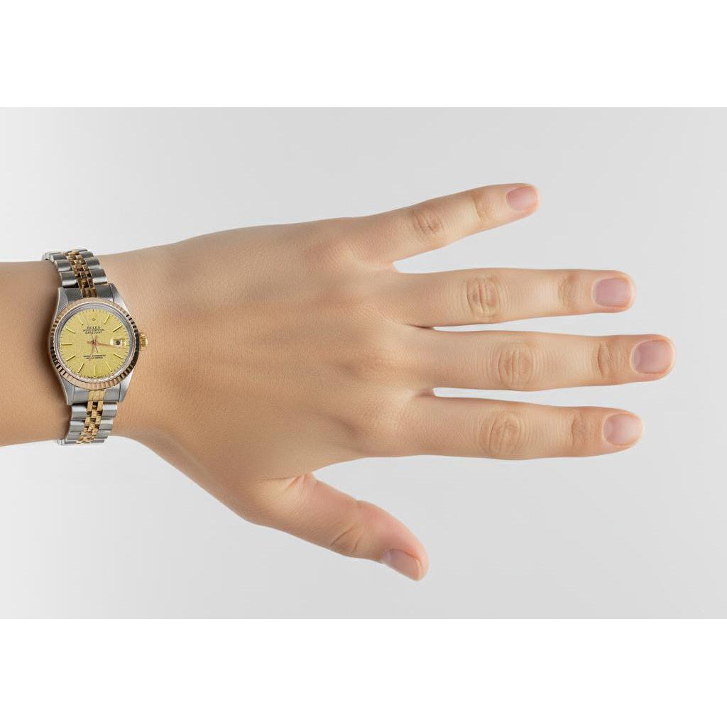 Orologio da donna con quadrante champagne e lunetta Rolex in oro giallo giubileo P2