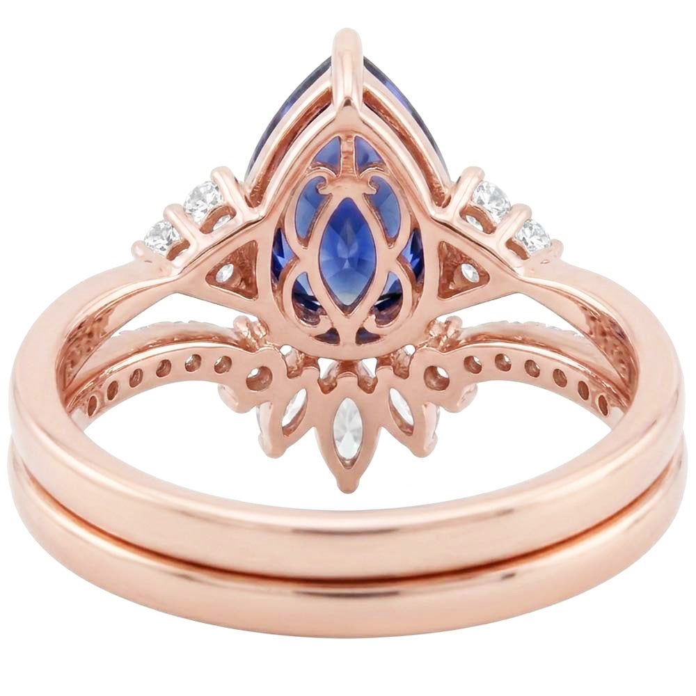 Set di fedi nuziali con zaffiro blu marquise da 4 carati e diamanti tondi