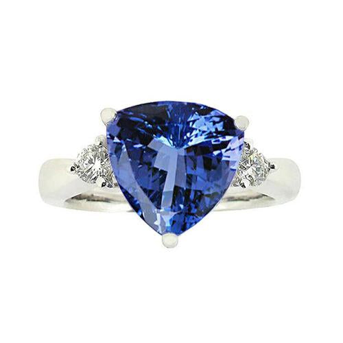 Anello a tre pietre con tanzanite 7 carati e diamanti. oro bianco 14 carati - harrychadent.it
