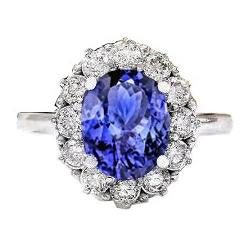 Anello con tanzanite ovale da 10 ct e diamanti incastonati in oro bianco 14 carati - harrychadent.it