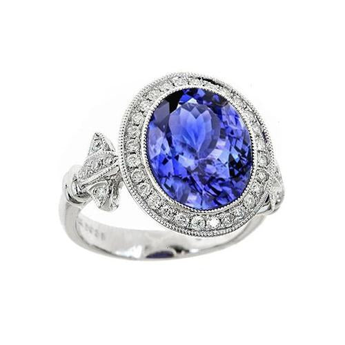Anello fantasia in tanzanite 9 carati con piccoli diamanti in oro bianco 14K - harrychadent.it