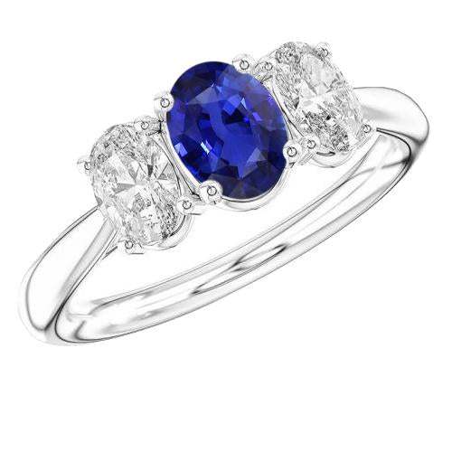 Anello in oro bianco con tre pietre e diamanti. zaffiro blu ovale. 2.50 carati - harrychadent.it