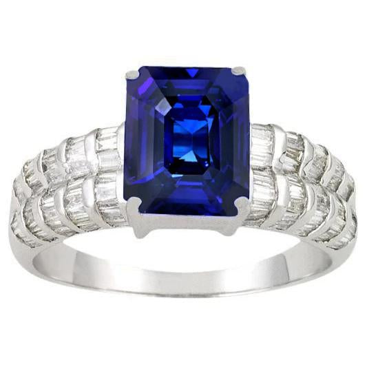 Anello in oro bianco con zaffiro di Ceylon da 7,51 ct, smeraldo e diamanti baguette - harrychadent.it