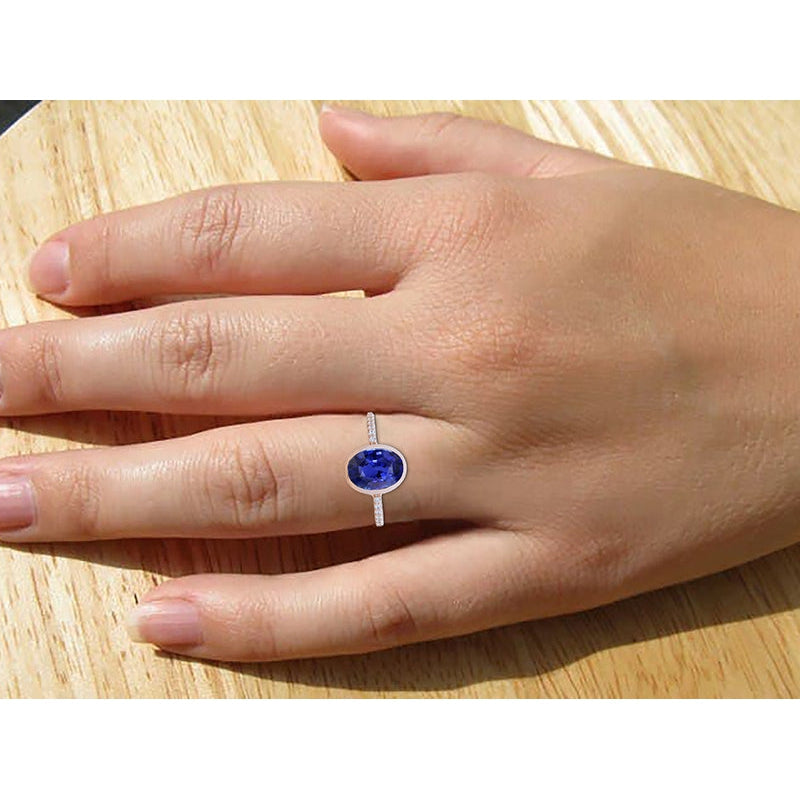 Anello solitario con zaffiro blu lunetta con diamanti in oro 3.50 carati - harrychadent.it