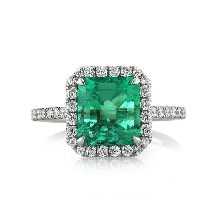 Fede nuziale in oro bianco con smeraldo verde grande e piccoli diamanti da 9.65 ct - harrychadent.it