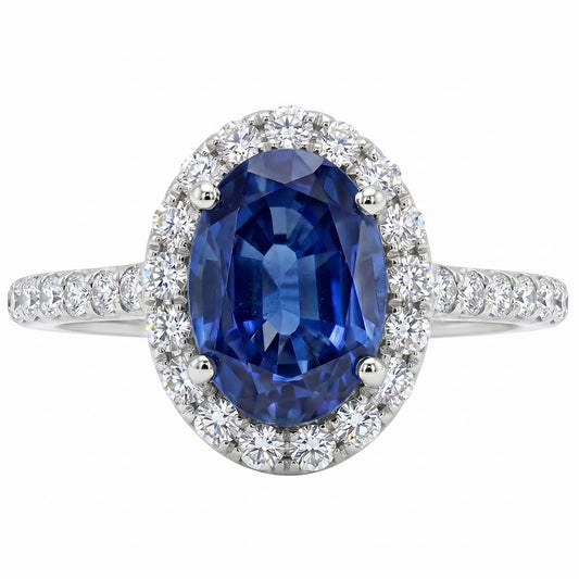 Anello Halo con diamante ovale. zaffiro blu accentato. oro bianco 5.50 carati