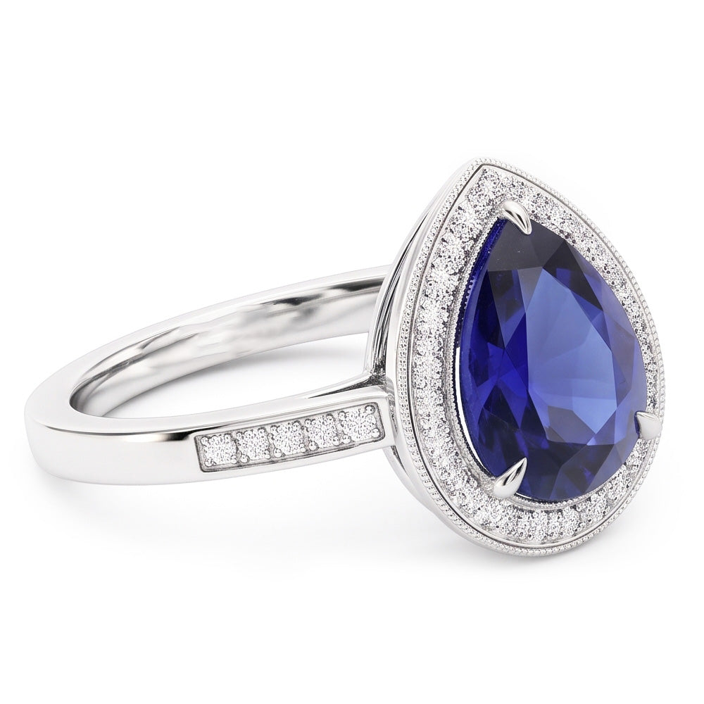 Anello Halo con pera di zaffiro blu da 2,50 carati e pavé di diamanti in oro bianco 14K