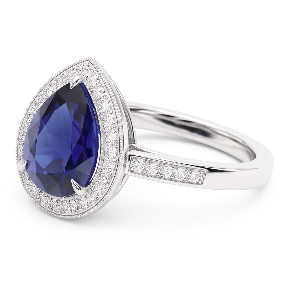 Anello Halo con pera di zaffiro blu da 2,50 carati e pavé di diamanti in oro bianco 14K