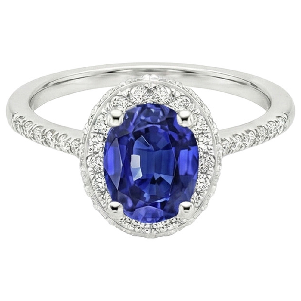 Anello Halo con zaffiro blu taglio ovale 3,75 carati e pavé di diamanti in oro bianco 14K