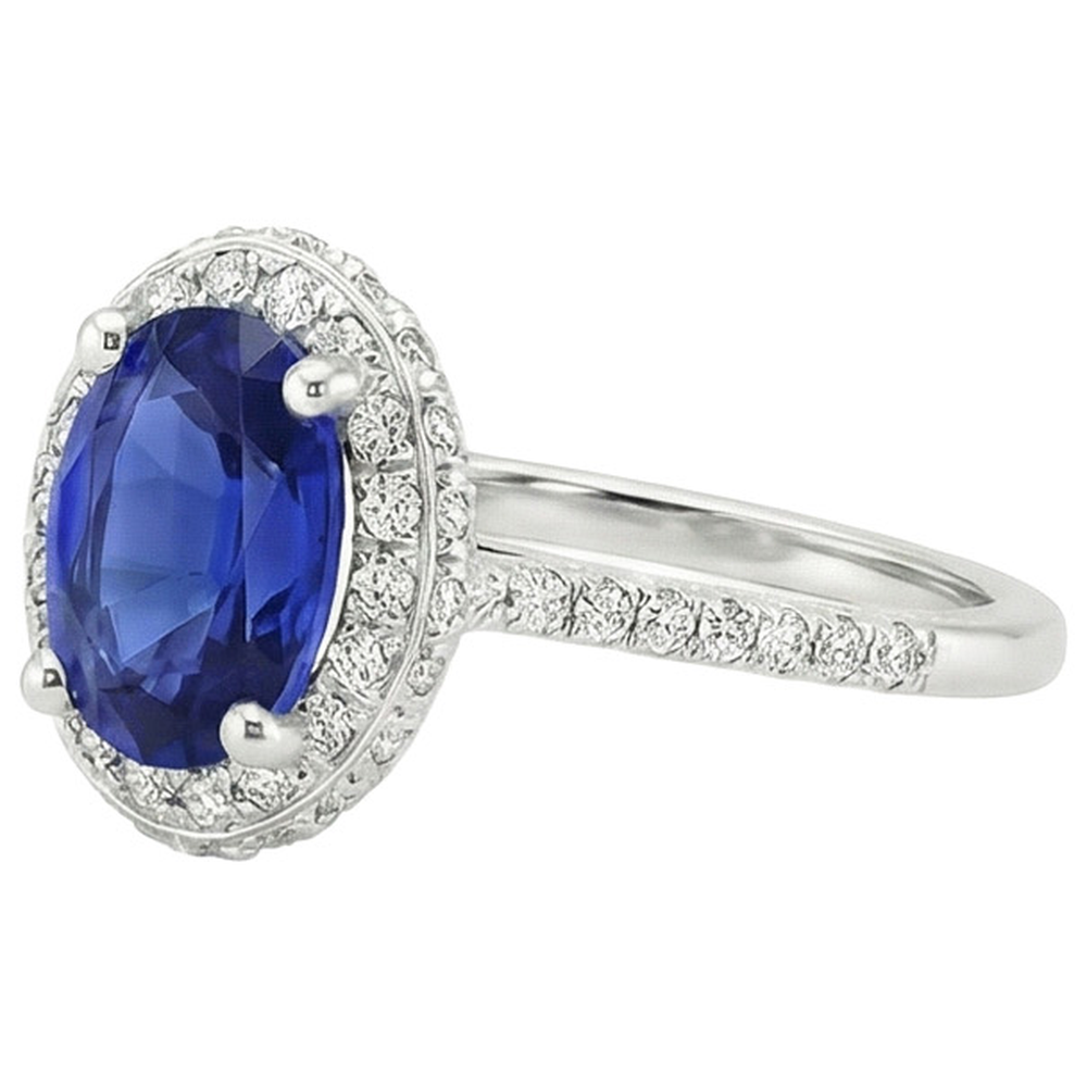Anello Halo con zaffiro blu taglio ovale 3,75 carati e pavé di diamanti in oro bianco 14K
