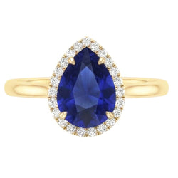 Anello Halo con zaffiro di Ceylon taglio a pera e diamanti. 3 carati a griffe