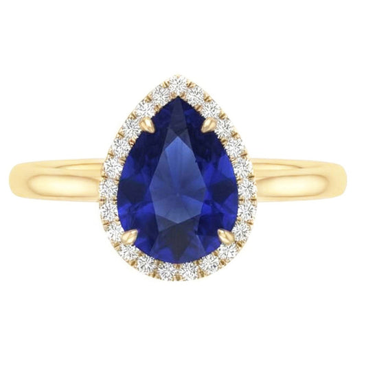 Anello Halo con zaffiro di Ceylon taglio a pera e diamanti. 3 carati a griffe