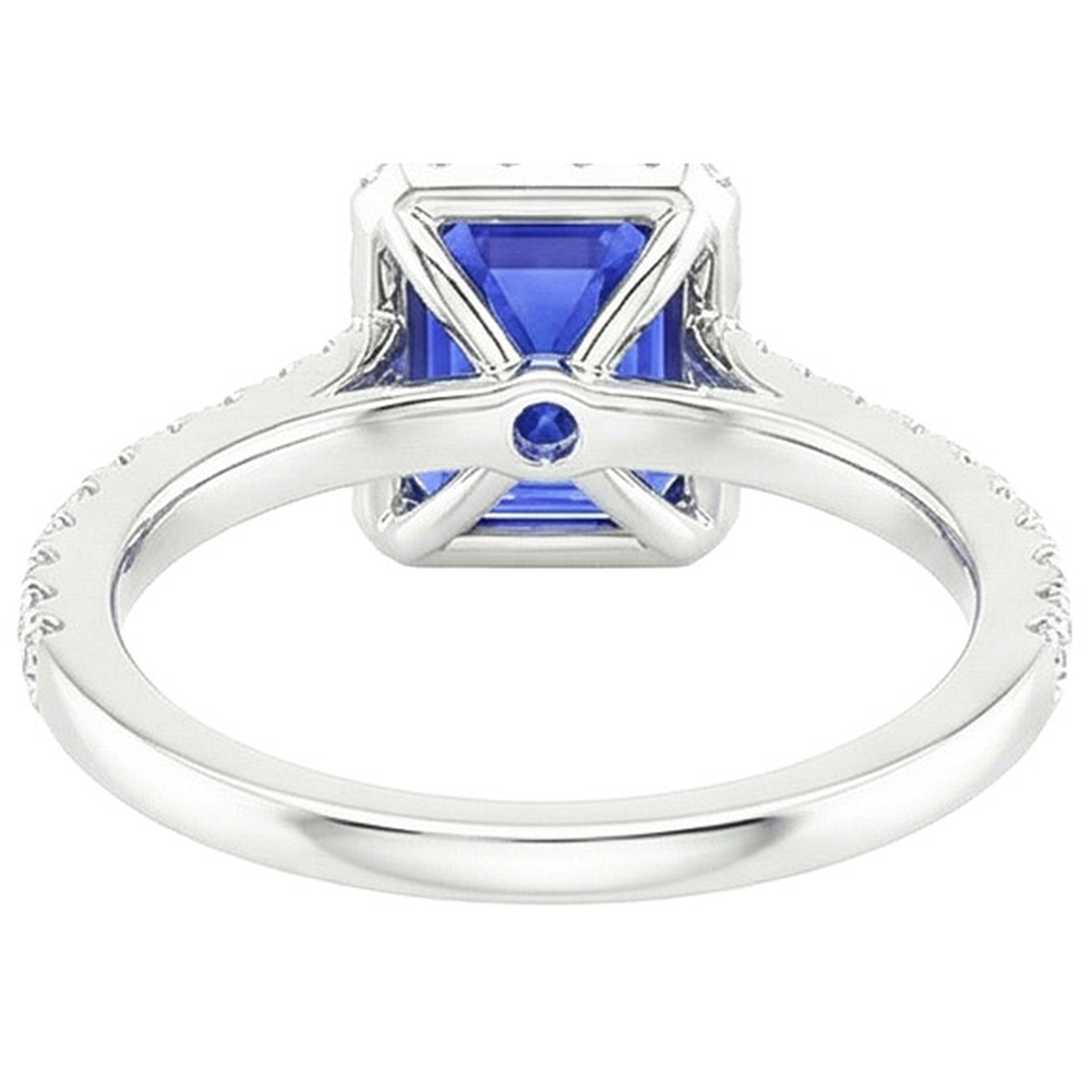 Anello Halo in oro bianco. zaffiro blu smeraldo e diamante 4.25 carati