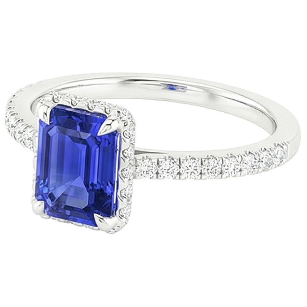 Anello Halo in oro bianco. zaffiro blu smeraldo e diamante 4.25 carati
