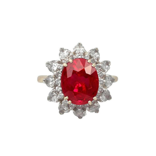 Anello a griffe con rubini e diamanti a taglio rotondo da 4.50 ct incastonati in oro giallo 14 kt - harrychadent.it