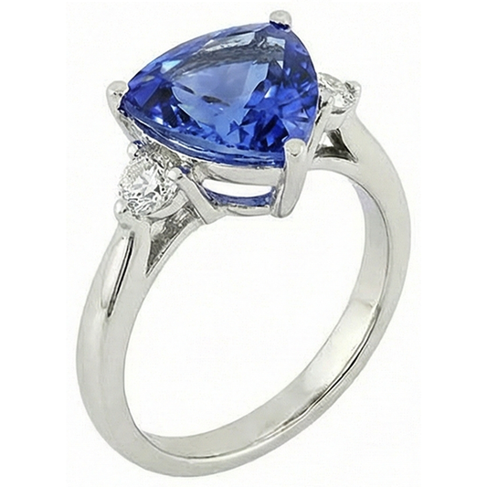 Anello a tre pietre con tanzanite 7 carati e diamanti. oro bianco 14K