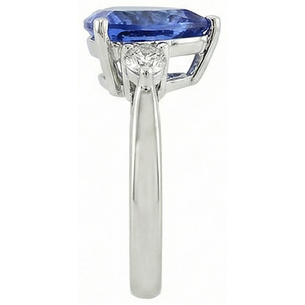 Anello a tre pietre con tanzanite 7 carati e diamanti. oro bianco 14K