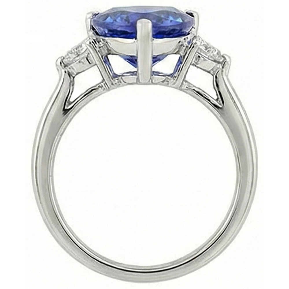 Anello a tre pietre con tanzanite 7 carati e diamanti. oro bianco 14K