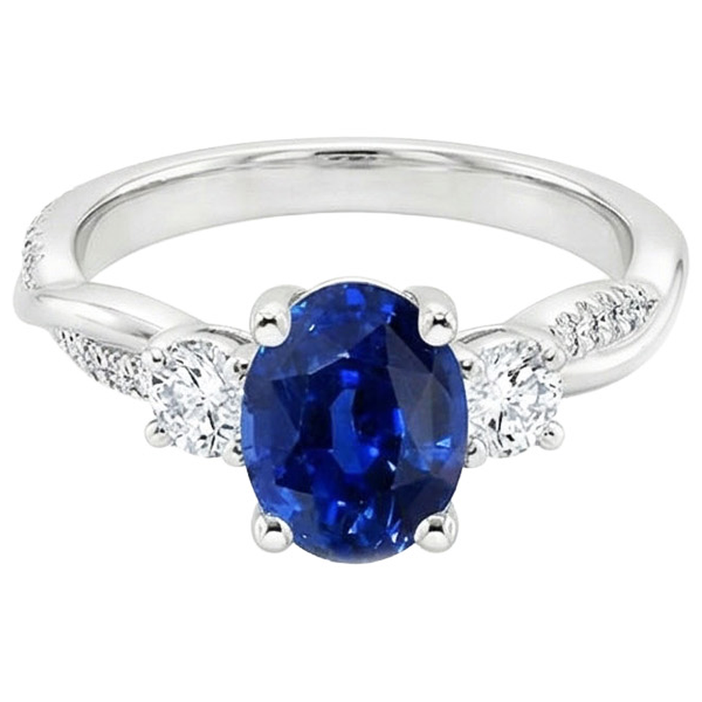 Anello a tre pietre con zaffiro blu ovale e accenti di diamanti rotondi 4 carati