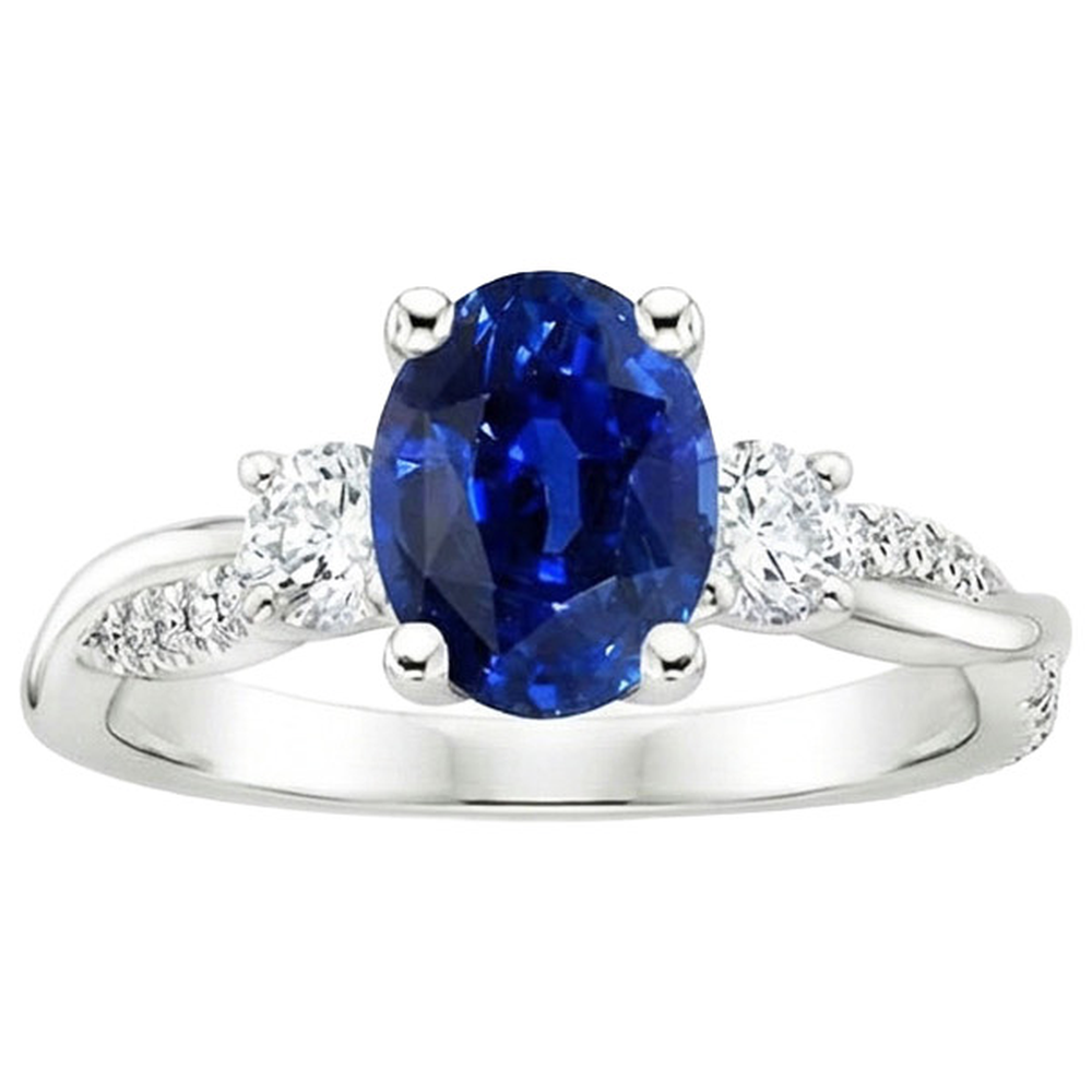 Anello a tre pietre con zaffiro blu ovale e accenti di diamanti rotondi 4 carati