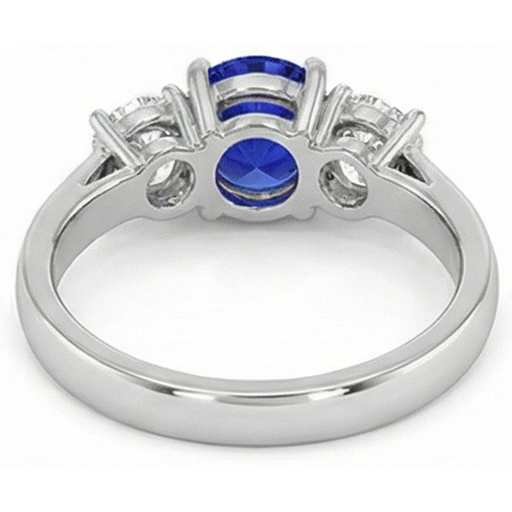 Anello con 3 pietre rotonde con zaffiri blu e diamanti. 4 carati. incastonati in oro 14K