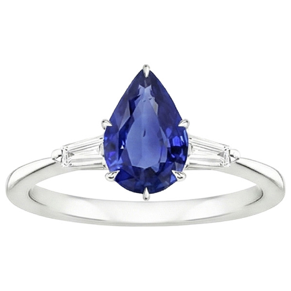 Anello con Zaffiro Blu Pera 3 Carati e Diamanti Baguette Tre Pietre in oro bianco 14 carati