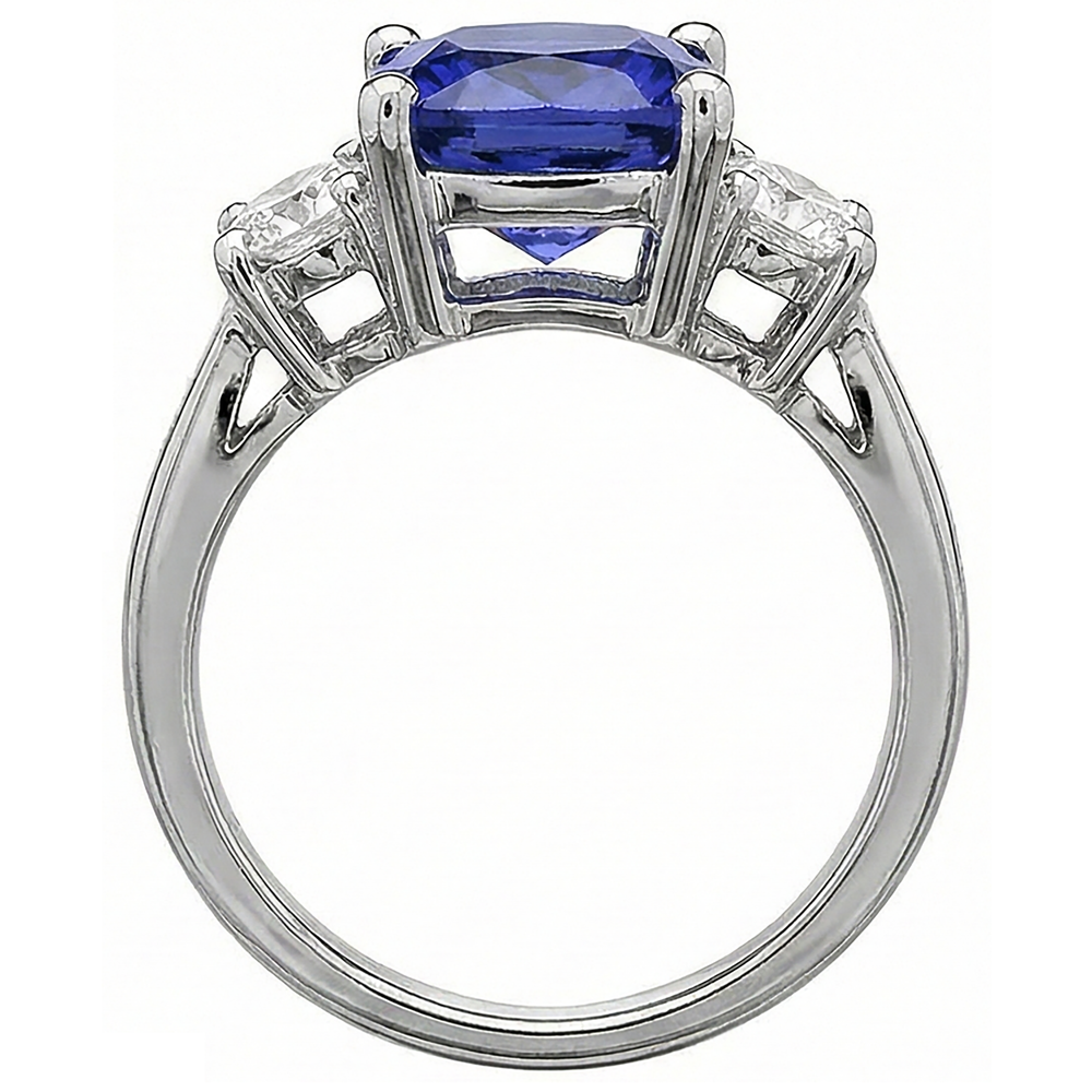 Anello con cuscino in tanzanite da 4.51 carati e diamanti rotondi Oro bianco 14K