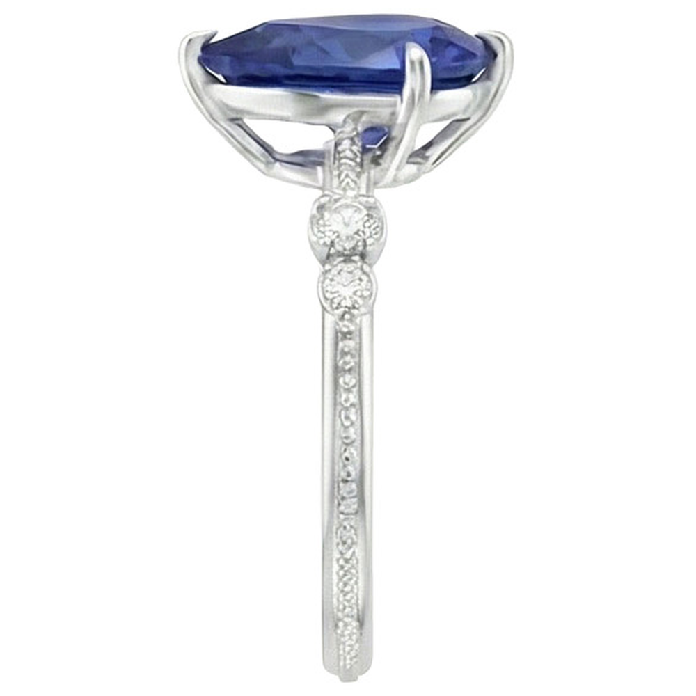 Anello con diamante. pera. zaffiro di Ceylon. 5 pietre. 2.50 carati