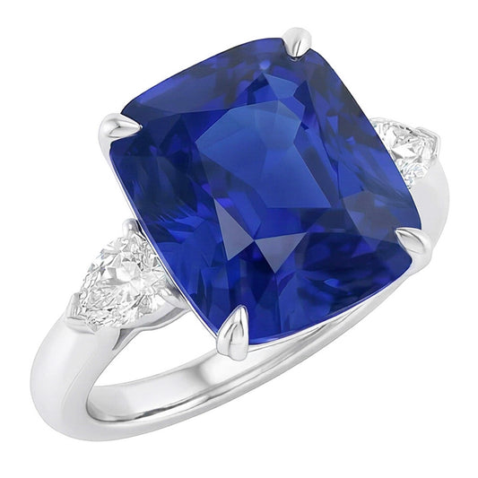 Anello con tre pietre con zaffiro blu 4 carati e diamanti pera