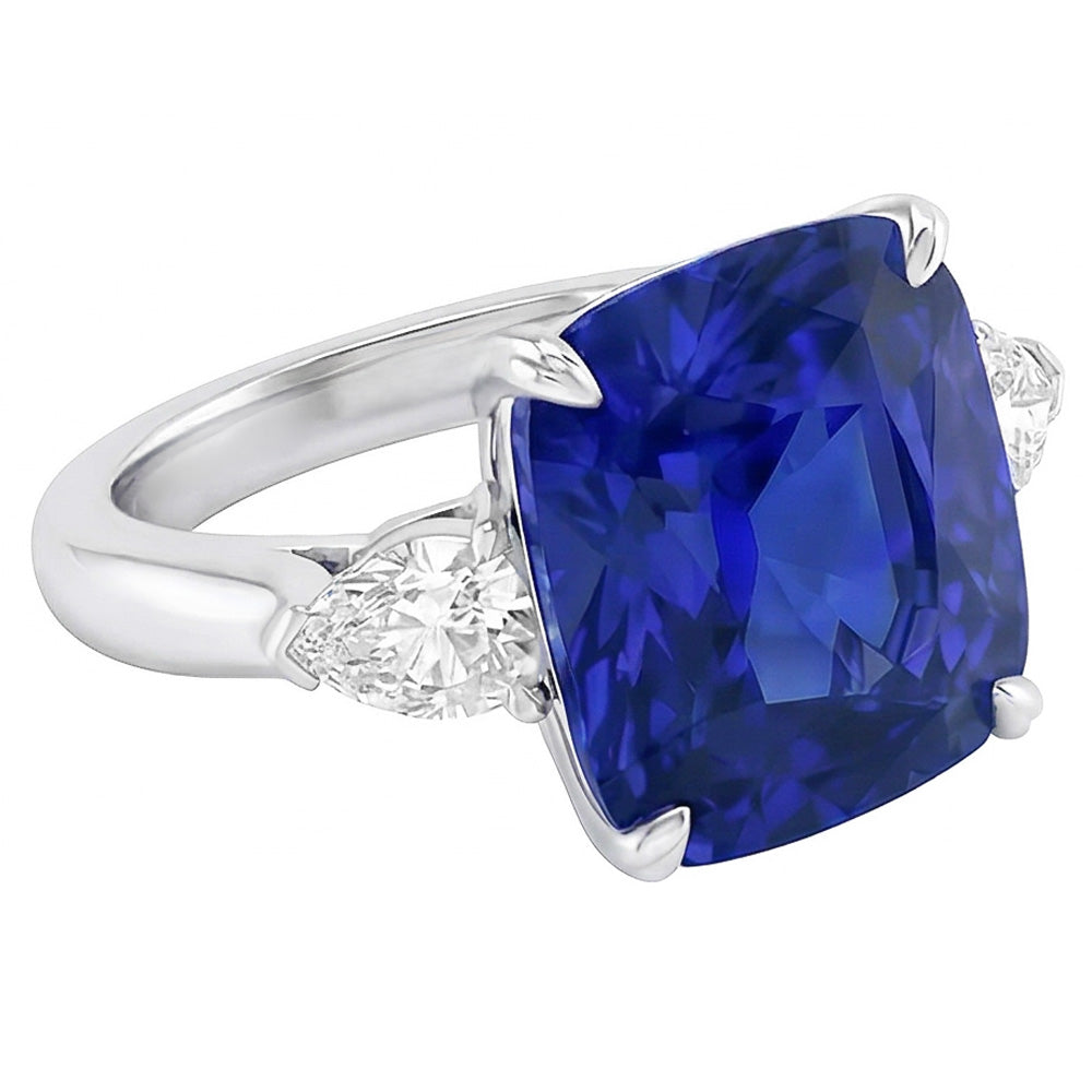 Anello con tre pietre con zaffiro blu 4 carati e diamanti pera