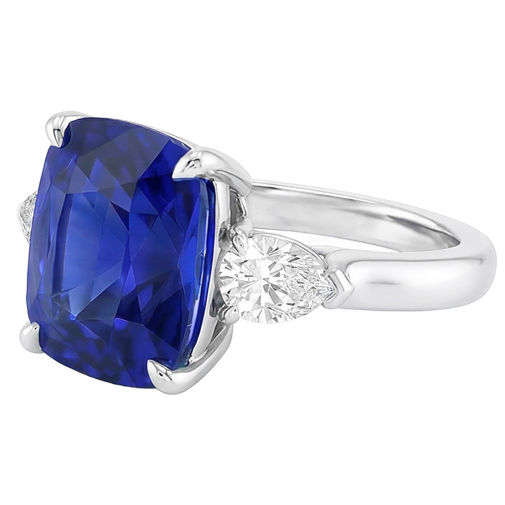 Anello con tre pietre con zaffiro blu 4 carati e diamanti pera