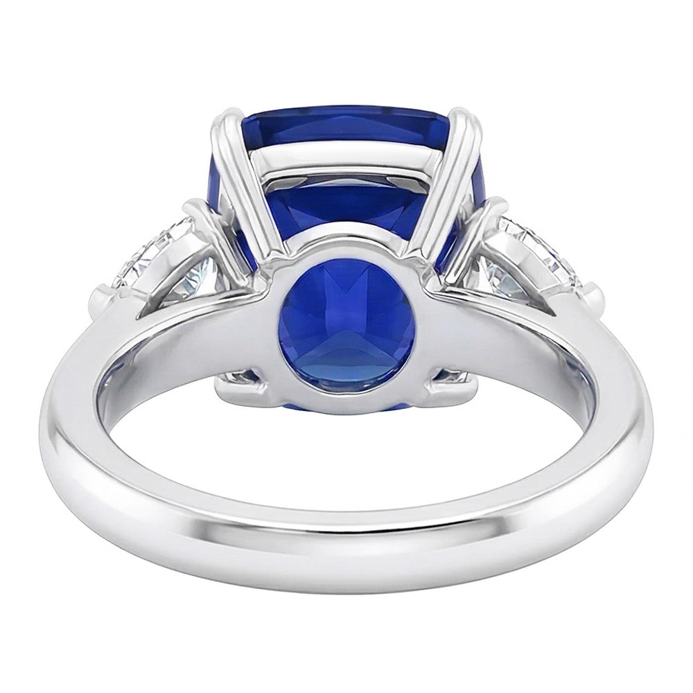 Anello con tre pietre con zaffiro blu 4 carati e diamanti pera