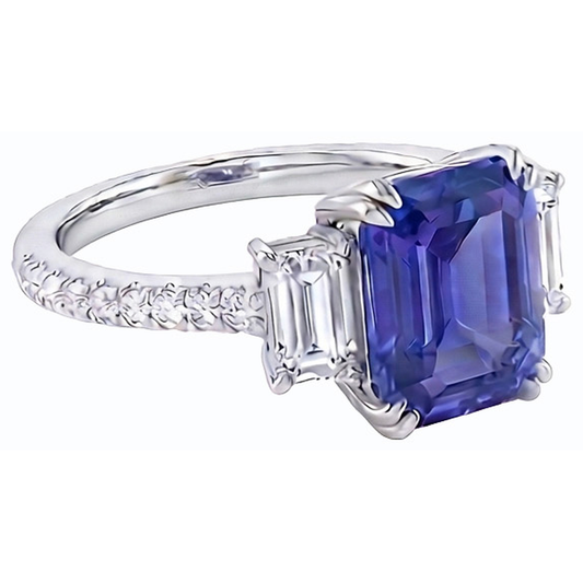 Anello con tre pietre di smeraldo e zaffiro blu e pavé di diamanti 3 carati