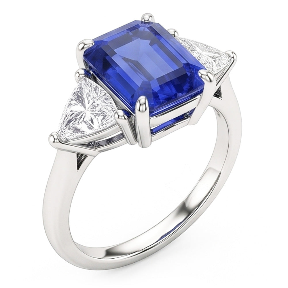 Anello con tre pietre di zaffiro blu. smeraldo e trilioni di diamanti 2.50 carati