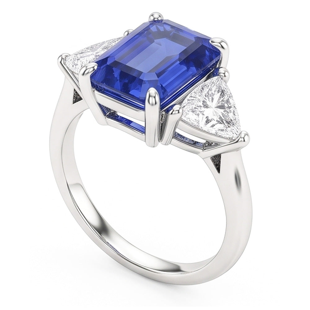 Anello con tre pietre di zaffiro blu. smeraldo e trilioni di diamanti 2.50 carati