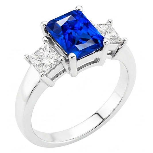 Anello con zaffiri blu Radiant 3 carati e diamanti Princess in oro bianco 14K