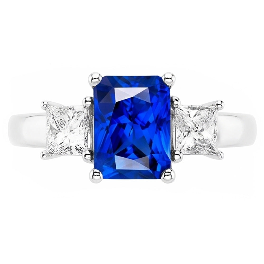Anello con zaffiri blu Radiant 3 carati e diamanti Princess in oro bianco 14K