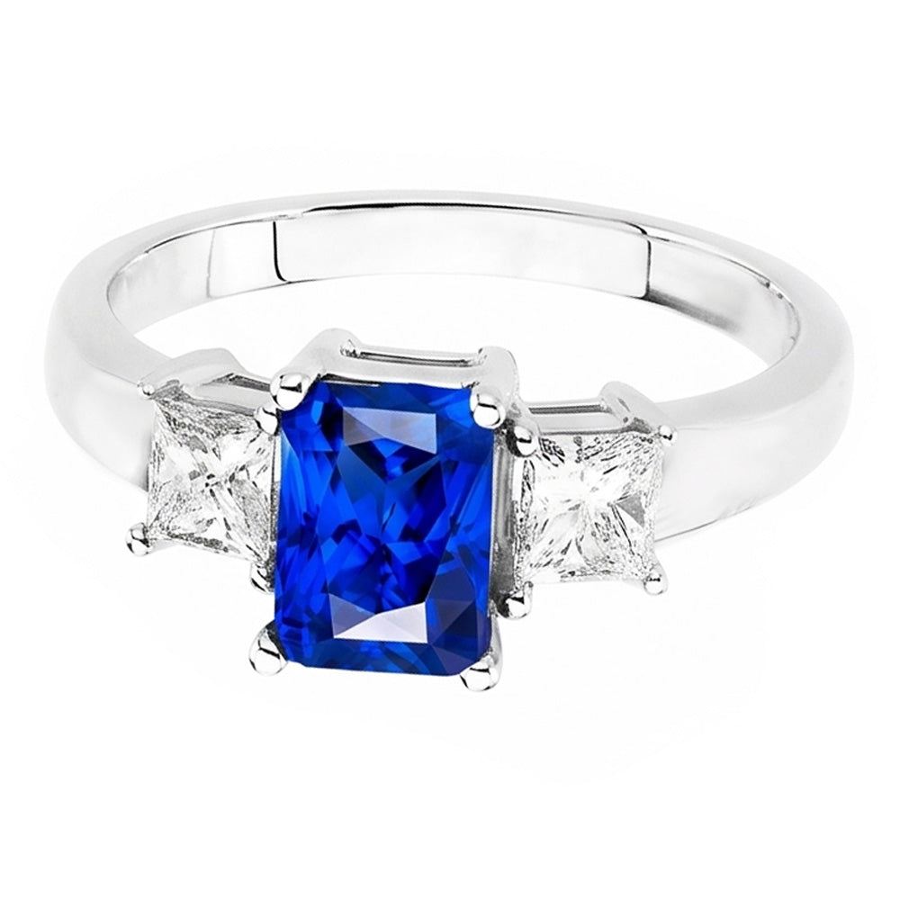 Anello con zaffiri blu Radiant 3 carati e diamanti Princess in oro bianco 14K