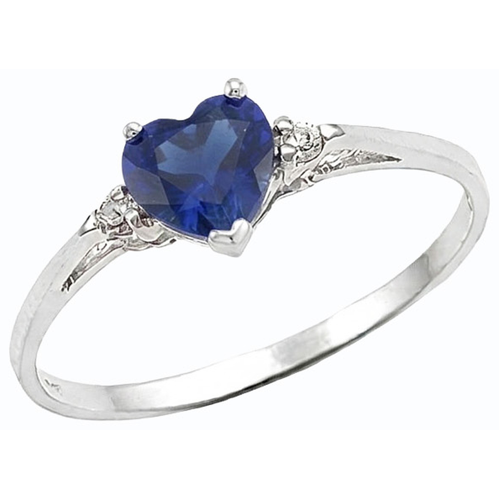 Anello con zaffiro a cuore da 1,75 carati dello Sri Lanka e tre pietre di diamanti tondi
