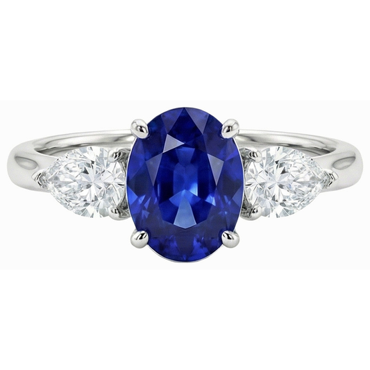 Anello con zaffiro blu profondo 3 carati e diamanti a forma di pera tre pietre ovali