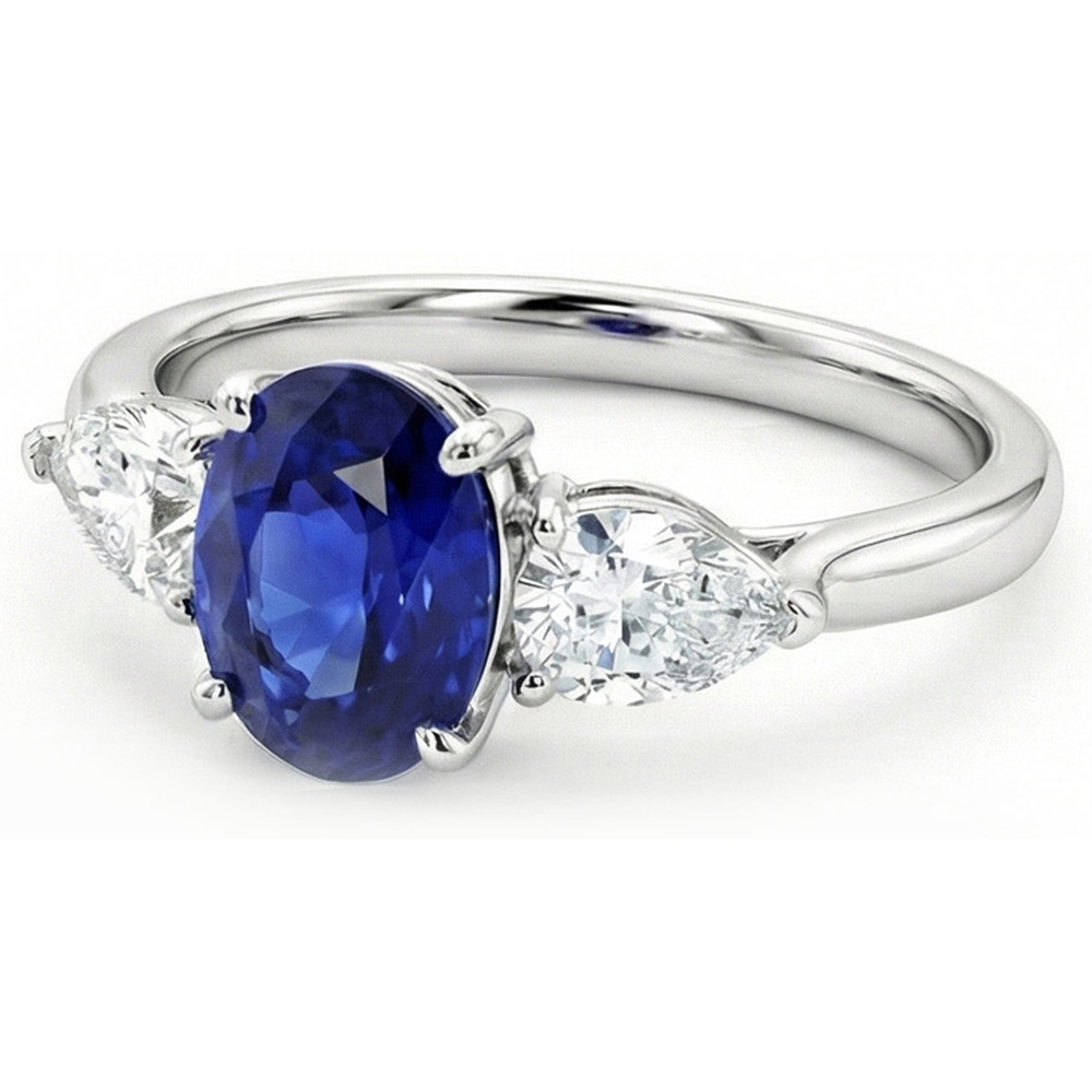 Anello con zaffiro blu profondo 3 carati e diamanti a forma di pera tre pietre ovali