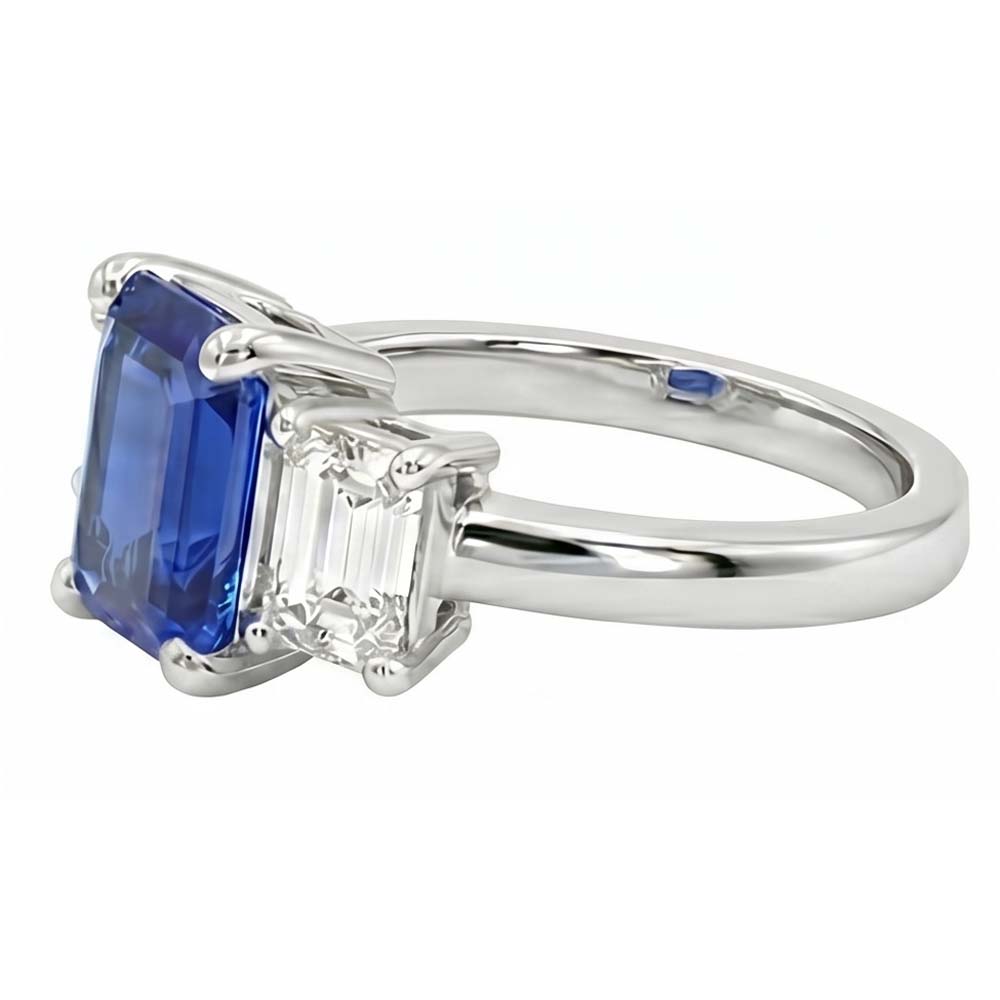 Anello con zaffiro blu smeraldo da 2,50 carati e diamanti tre pietre